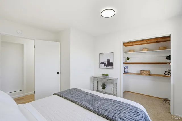 a bedroom with a bed and a cabinets