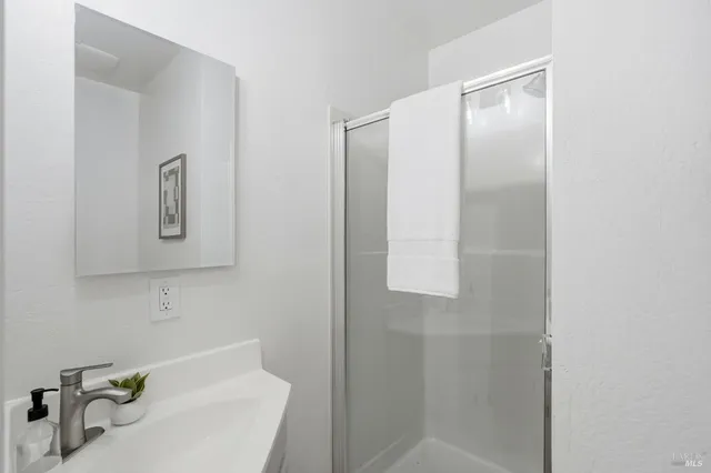 a bathroom with a bathtub and shower