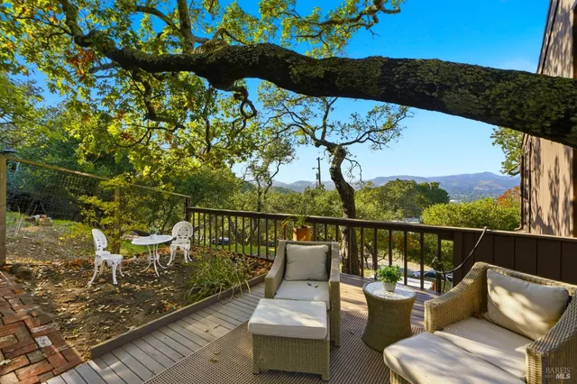 a view of a balcony with chairs