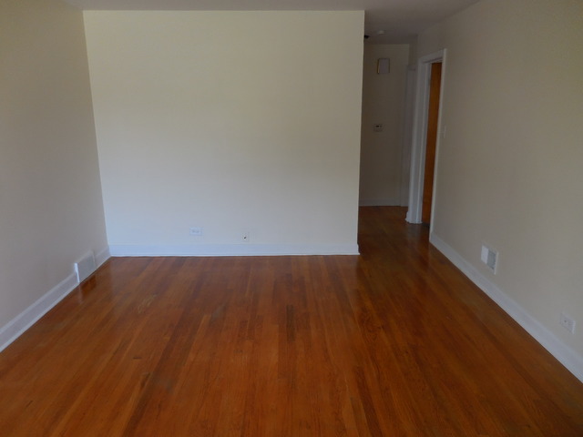 4723 Butterfield Road Hillside, IL 60162 - Photo 3 of 10 an empty room with wooden floor