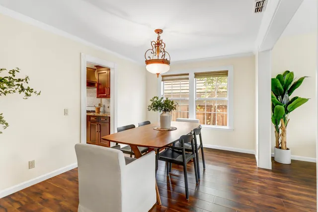 a kitchen with a stove a sink and a microwave