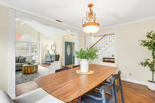 a kitchen with stainless steel appliances granite countertop a refrigerator and a stove