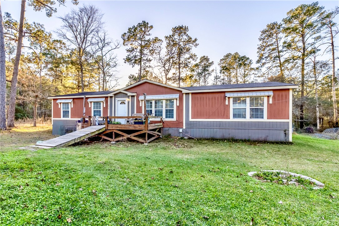 a house view with a sitting space and garden