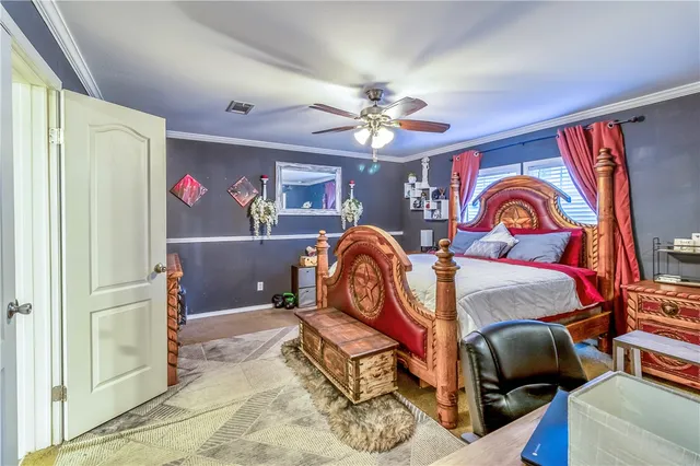 a bedroom with furniture and a chandelier