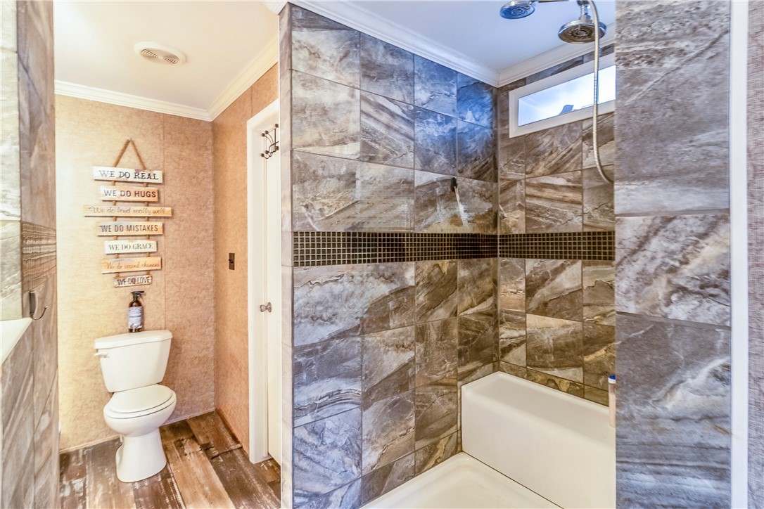 6258 North Hill Road Navasota, TX 77868 - Photo 15 of 30 a bathroom with a toilet and a shower