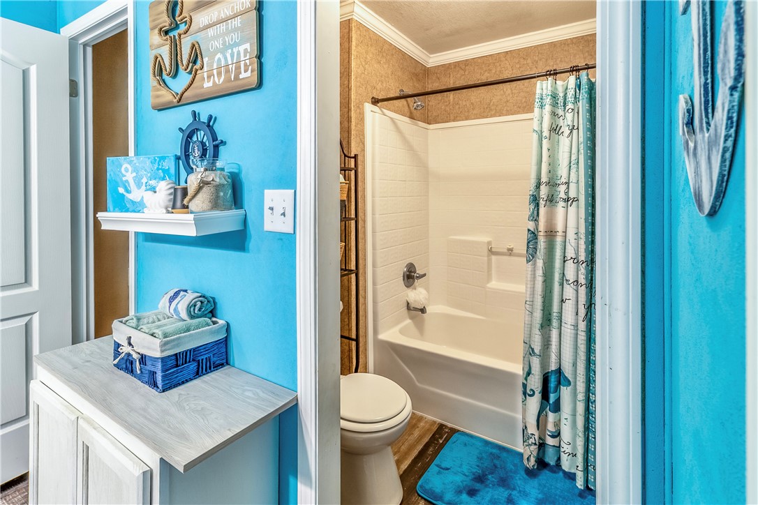 6258 North Hill Road Navasota, TX 77868 - Photo 20 of 30 a bathroom with a sink toilet and shower