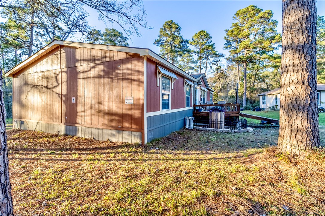 6258 North Hill Road Navasota, TX 77868 - Photo 28 of 30 a view of a house with a yard