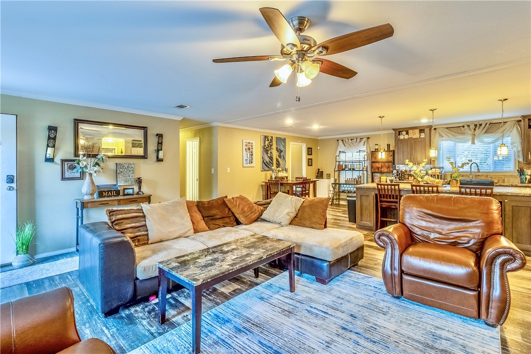 6258 North Hill Road Navasota, TX 77868 - Photo 4 of 30 a living room with furniture kitchen view and a wooden floor