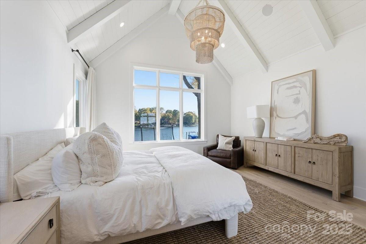 21520 Rio Oro Drive Cornelius, NC 28031 - Photo 18 of 43 a bedroom with a large bed and a dresser