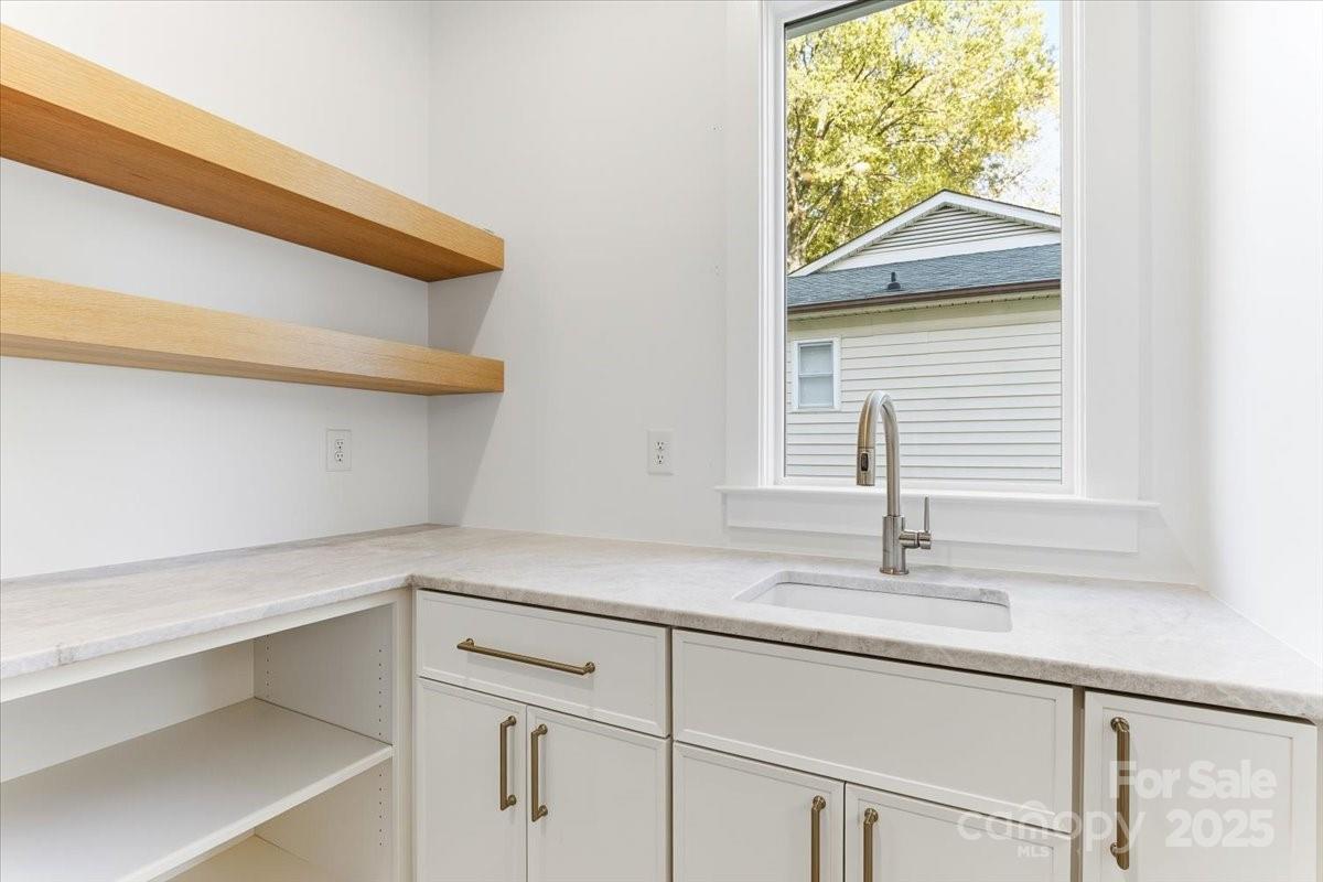 21520 Rio Oro Drive Cornelius, NC 28031 - Photo 24 of 43 a bathroom with a sink and a window