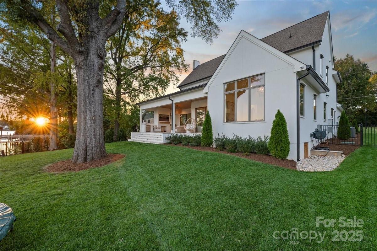 21520 Rio Oro Drive Cornelius, NC 28031 - Photo 36 of 43 a front view of a house with garden