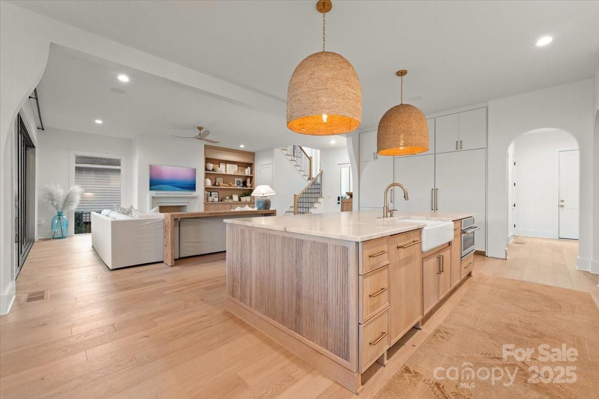 21520 Rio Oro Drive Cornelius, NC 28031 - Photo 8 of 43 a large kitchen with stainless steel appliances granite countertop a stove and a sink