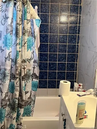 a view of a bathtub and a bathroom