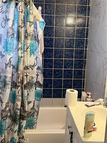 a view of a bathtub and a bathroom