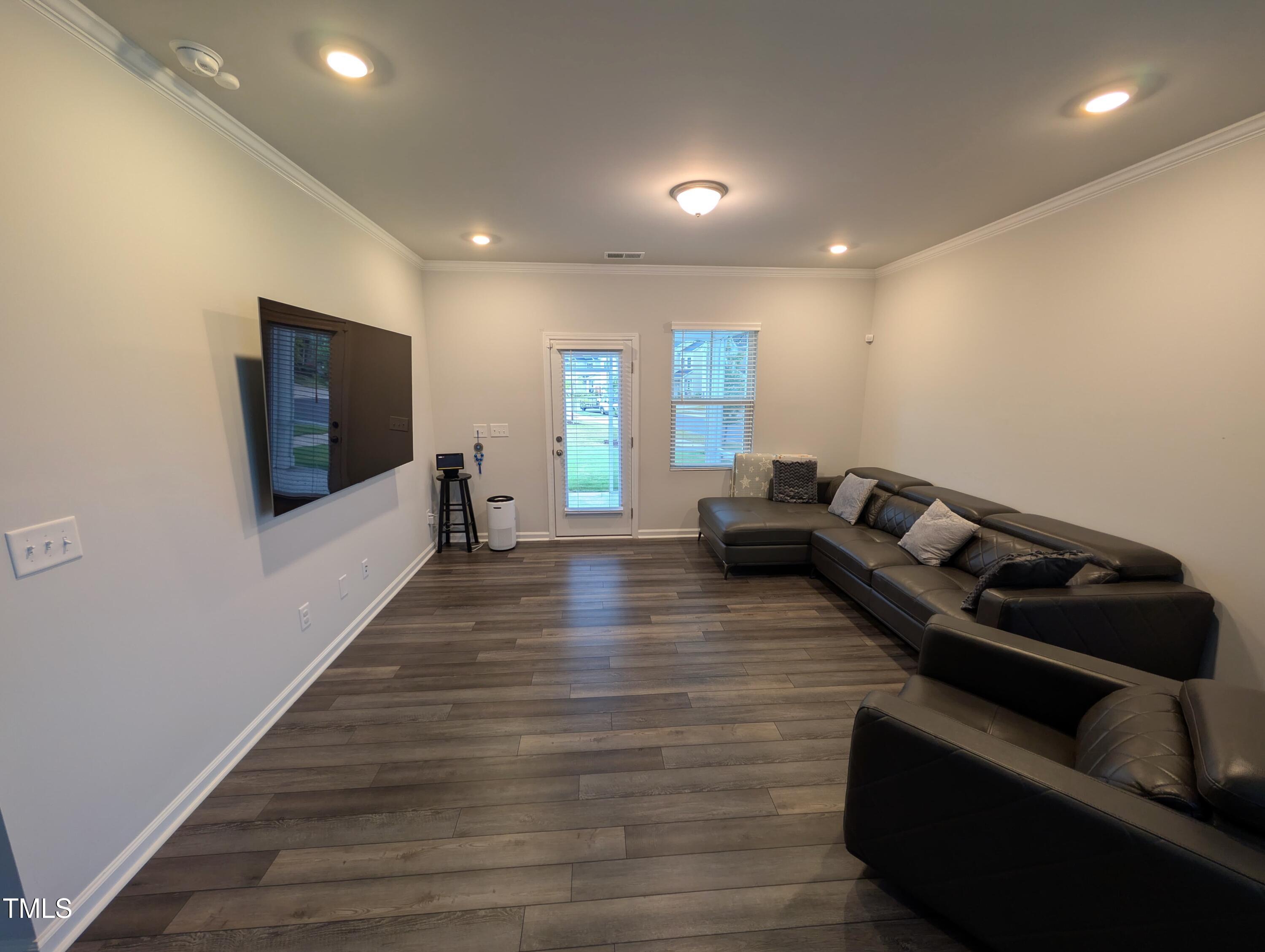 3300 Star Gazing Lane Durham, NC 27703 - Photo 2 of 31 a living room with furniture and a flat screen tv
