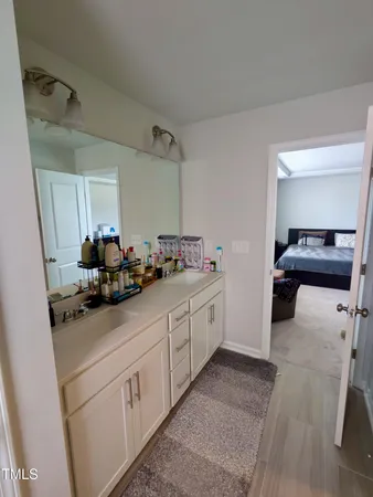 a kitchen with sink and cabinets