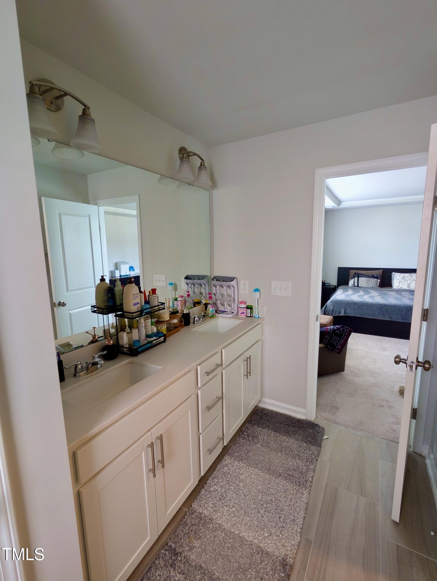 3300 Star Gazing Lane Durham, NC 27703 - Photo 21 of 31 a kitchen with sink and cabinets