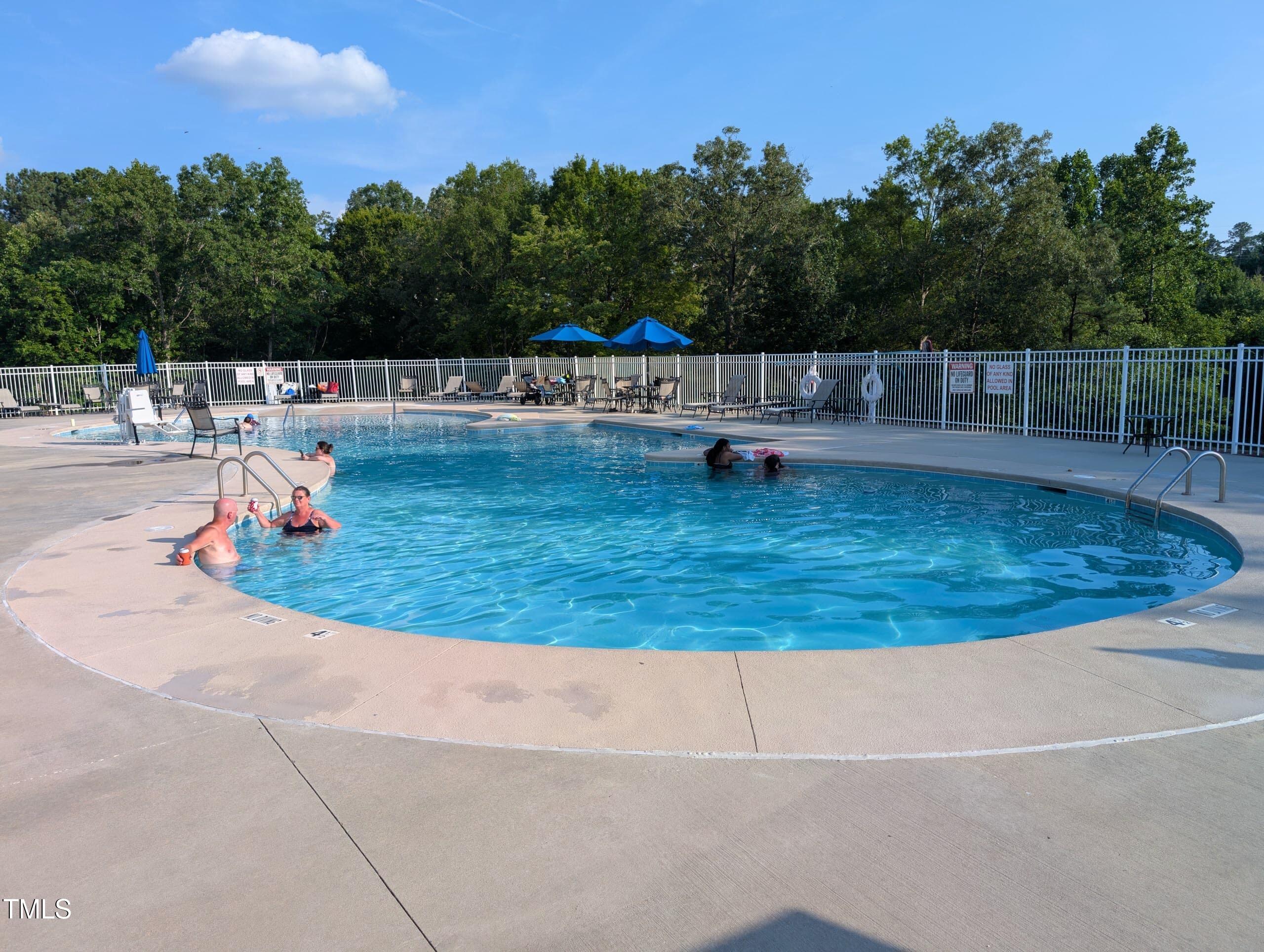 3300 Star Gazing Lane Durham, NC 27703 - Photo 29 of 31 a view of a swimming pool with a yard