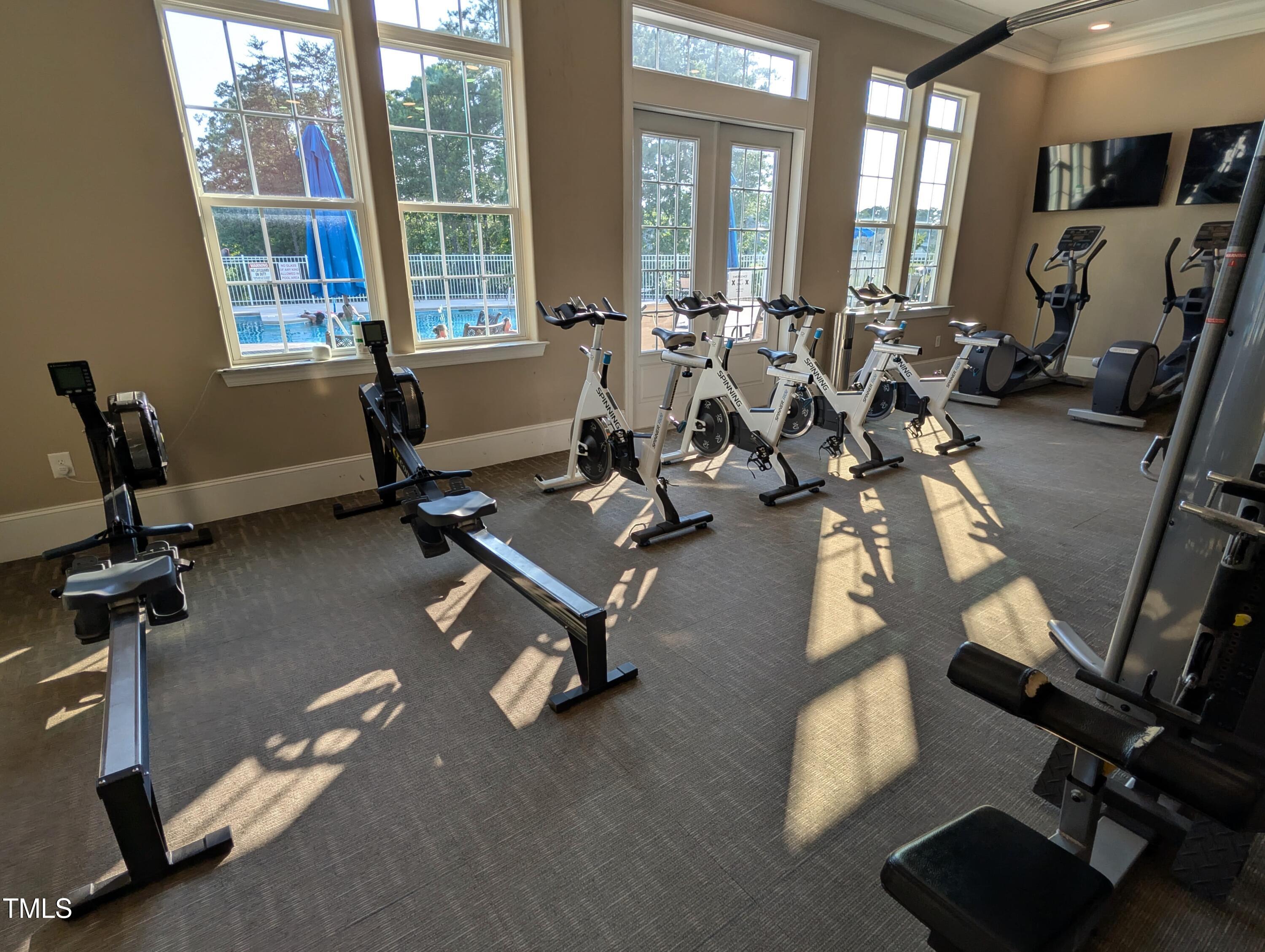 3300 Star Gazing Lane Durham, NC 27703 - Photo 31 of 31 a room with gym equipment and a large window