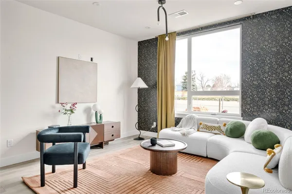 a living room with furniture and a large window