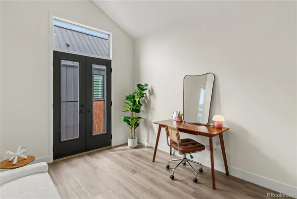 a workspace with furniture and wooden floor