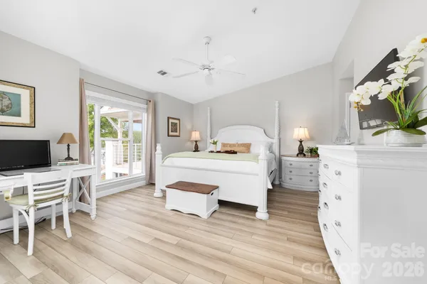 a room with furniture a bed and a flat screen tv