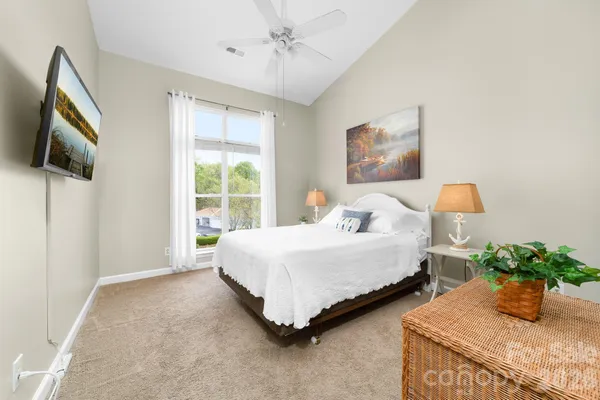 a bedroom with bed and window