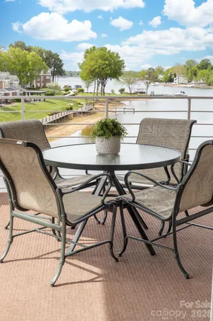a view of swimming pool with outdoor seating and plants