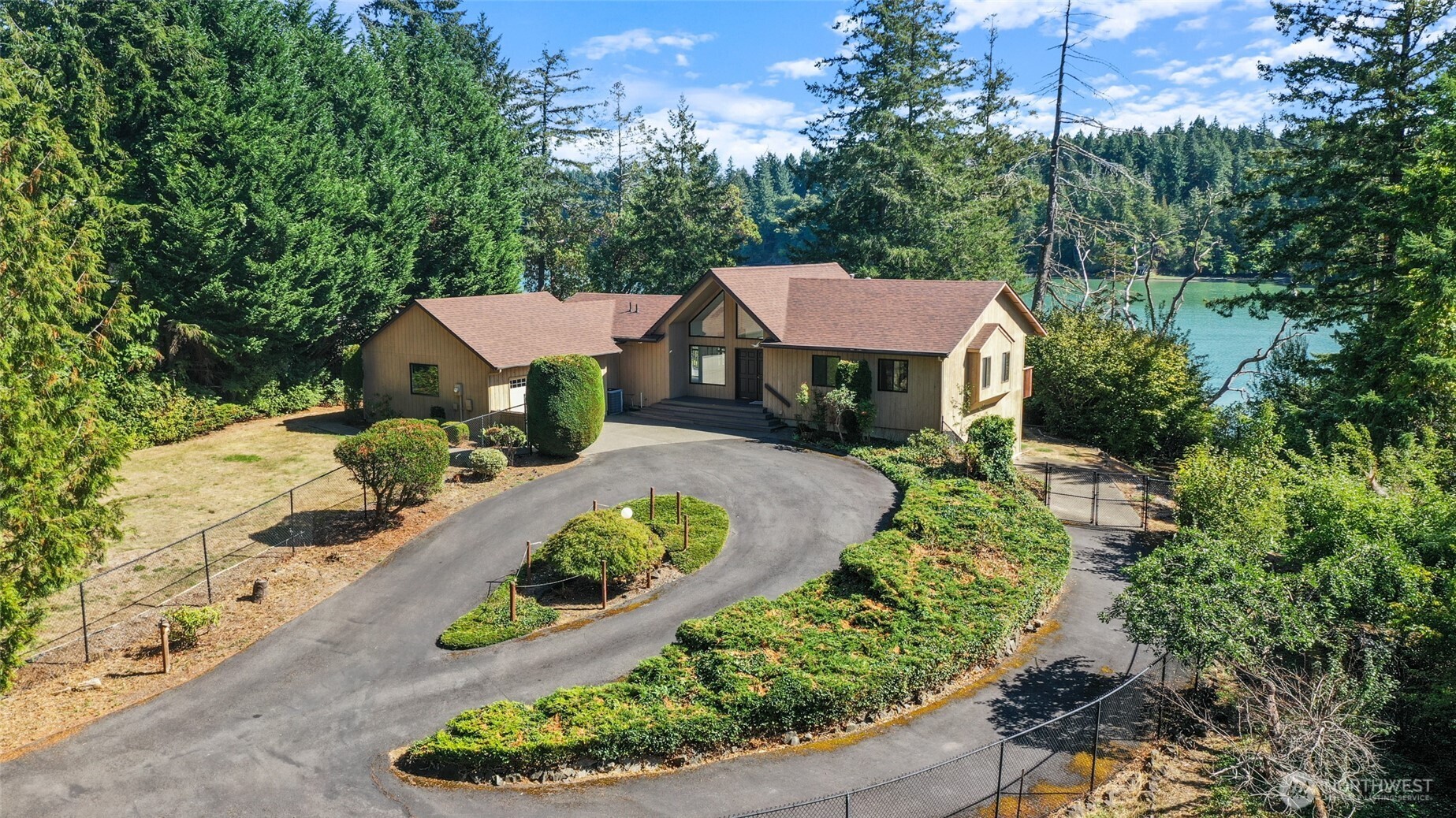 7922 Ellison Loop Northwest Olympia, WA 98502 - Photo 1 of 40 an aerial view of a house with a yard and large trees