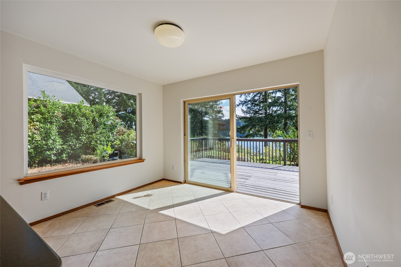 7922 Ellison Loop Northwest Olympia, WA 98502 - Photo 12 of 40 a room with a large window and a bed