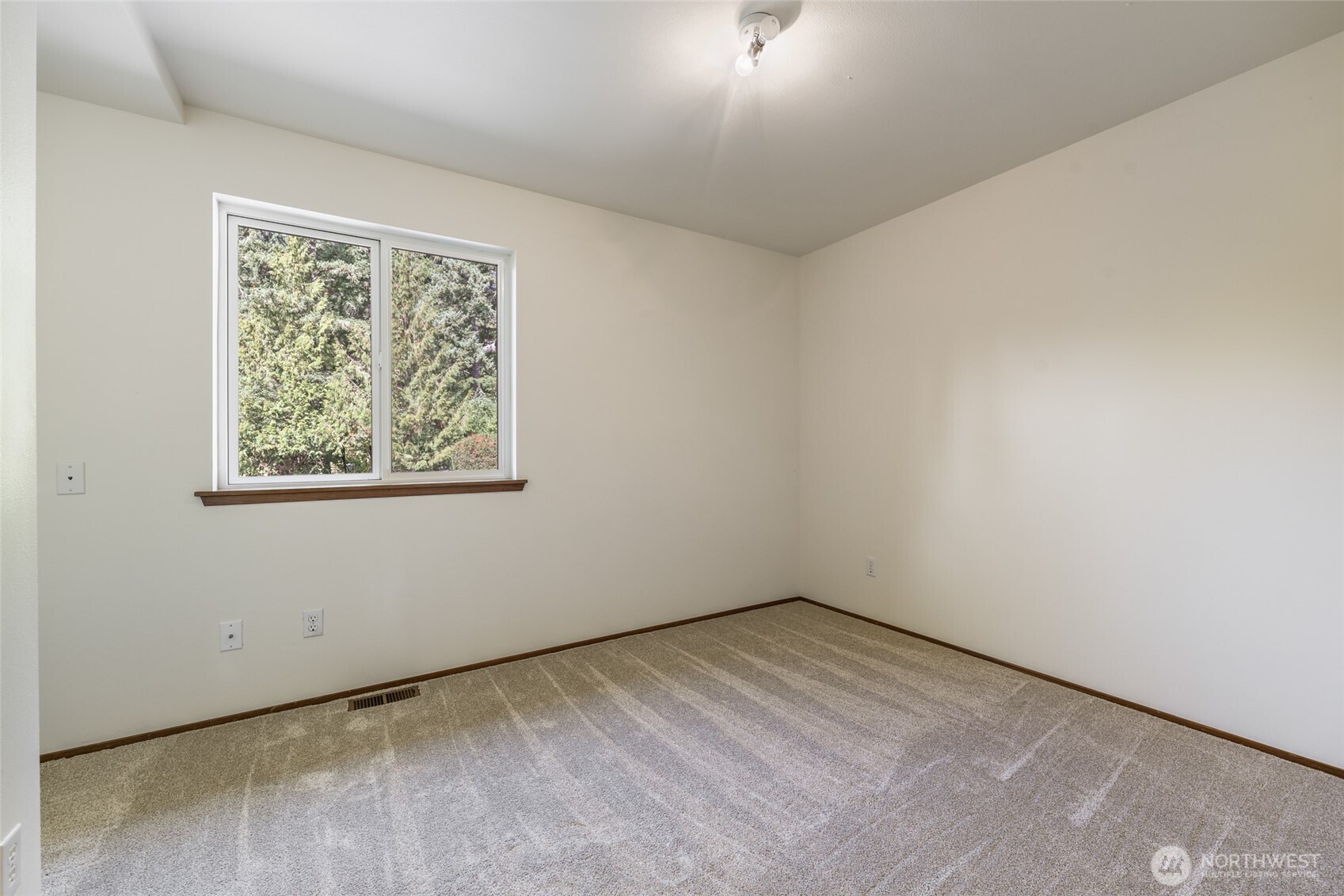 7922 Ellison Loop Northwest Olympia, WA 98502 - Photo 17 of 40 an empty room with a window