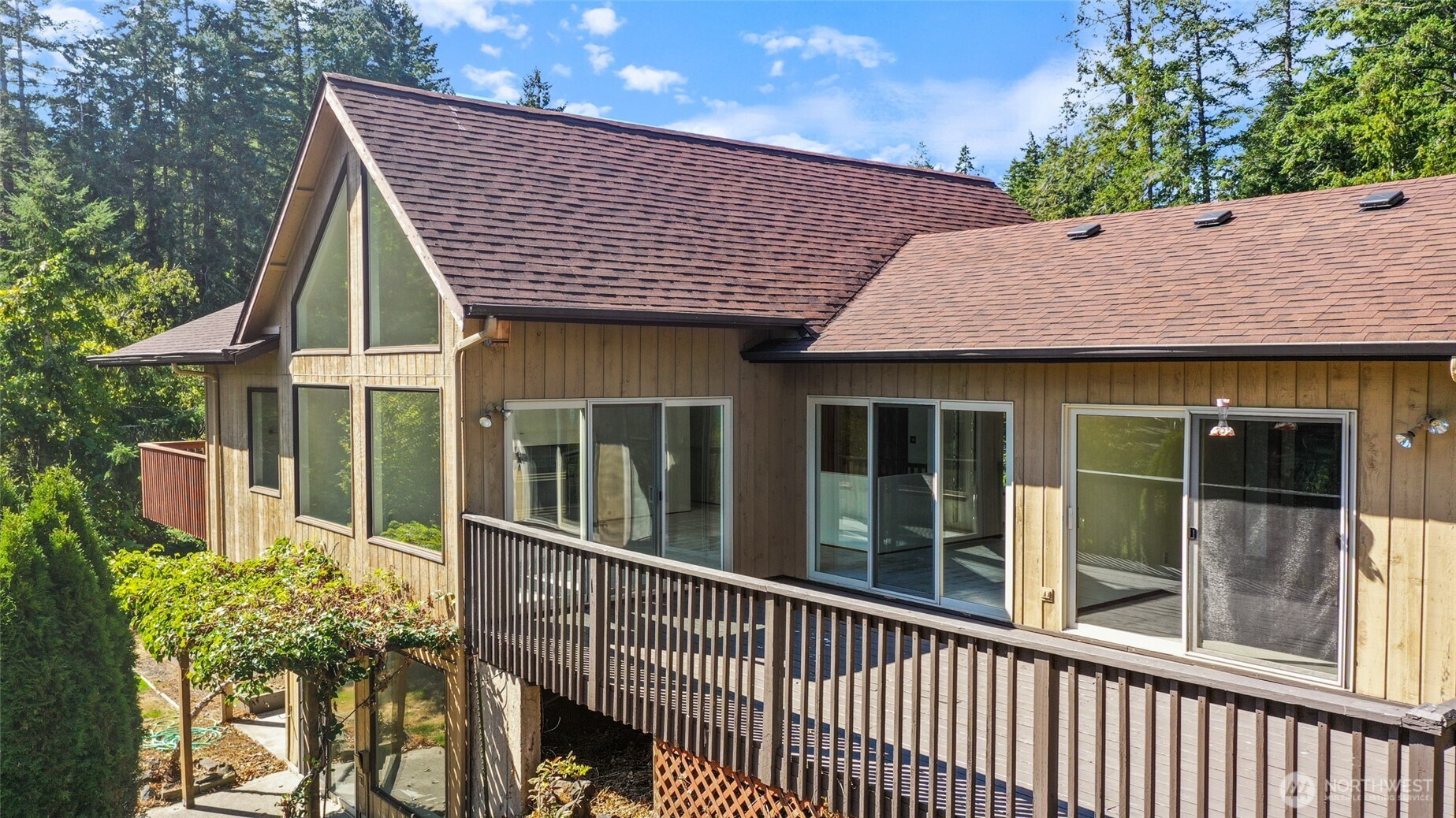 7922 Ellison Loop Northwest Olympia, WA 98502 - Photo 2 of 40 a front view of a house with a garden