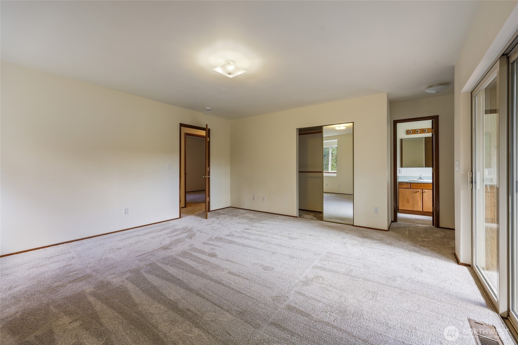 7922 Ellison Loop Northwest Olympia, WA 98502 - Photo 21 of 40 an empty room with closet and mirrors