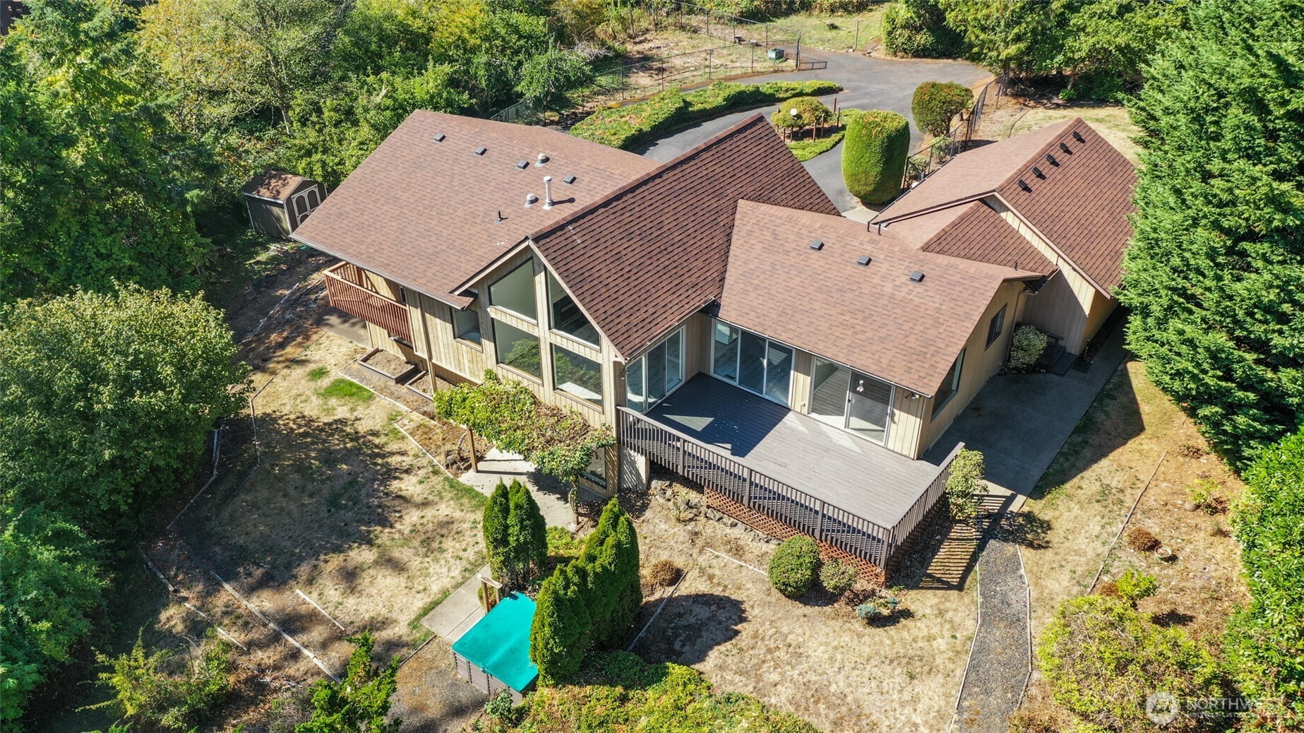 7922 Ellison Loop Northwest Olympia, WA 98502 - Photo 38 of 40 an aerial view of a house with a yard and trees all around