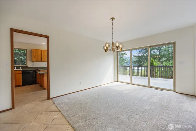 a view of an empty room with a balcony