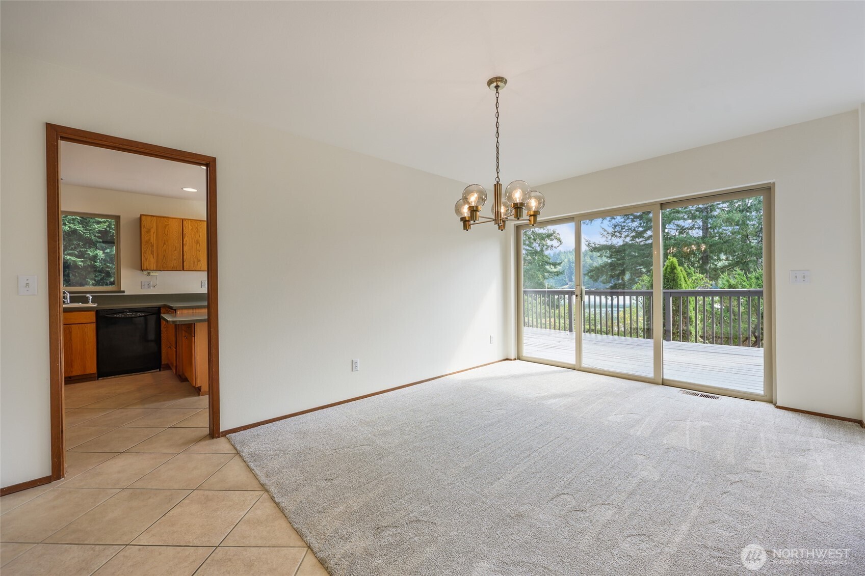 7922 Ellison Loop Northwest Olympia, WA 98502 - Photo 8 of 40 a view of an empty room with a balcony