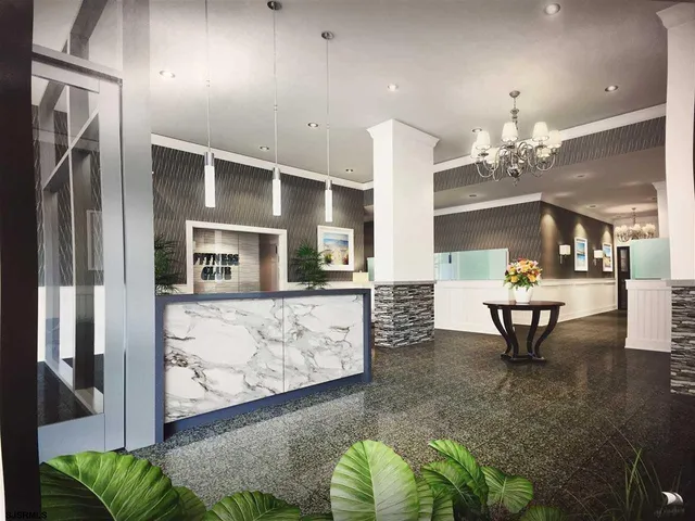 a lobby with furniture and potted plant