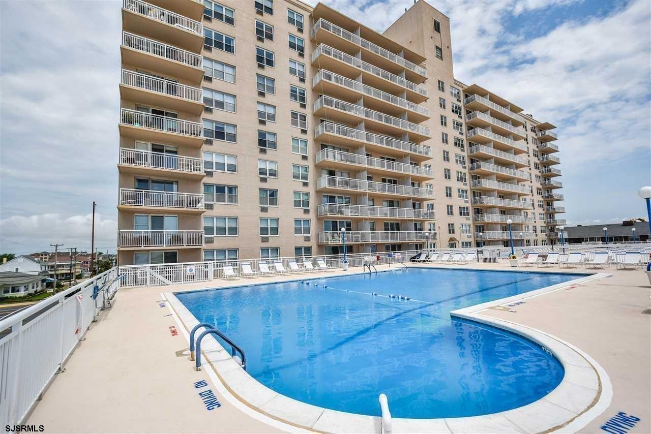 9400 Atlantic Avenue, Unit 912 Margate City, NJ 08402 - Photo 24 of 31 a view of a swimming pool with outdoor seating