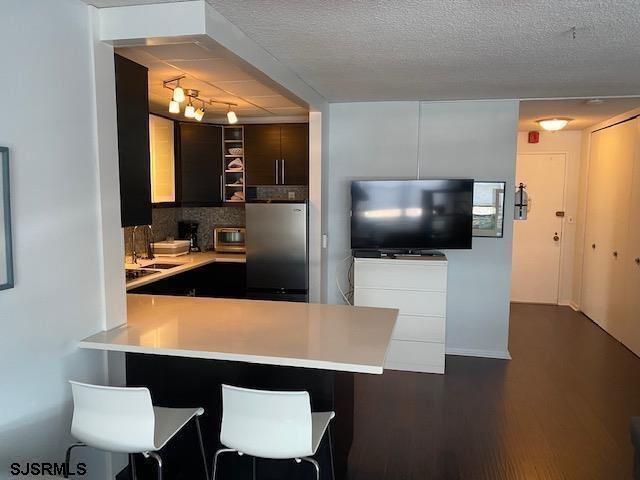 9400 Atlantic Avenue, Unit 912 Margate City, NJ 08402 - Photo 8 of 31 a kitchen with a table and chairs in it