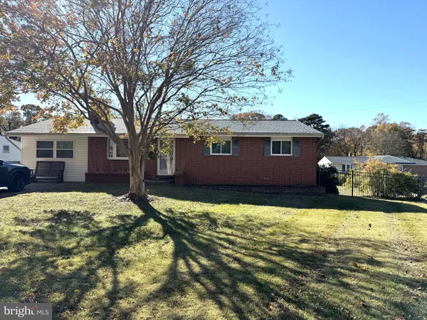a view of house with yard