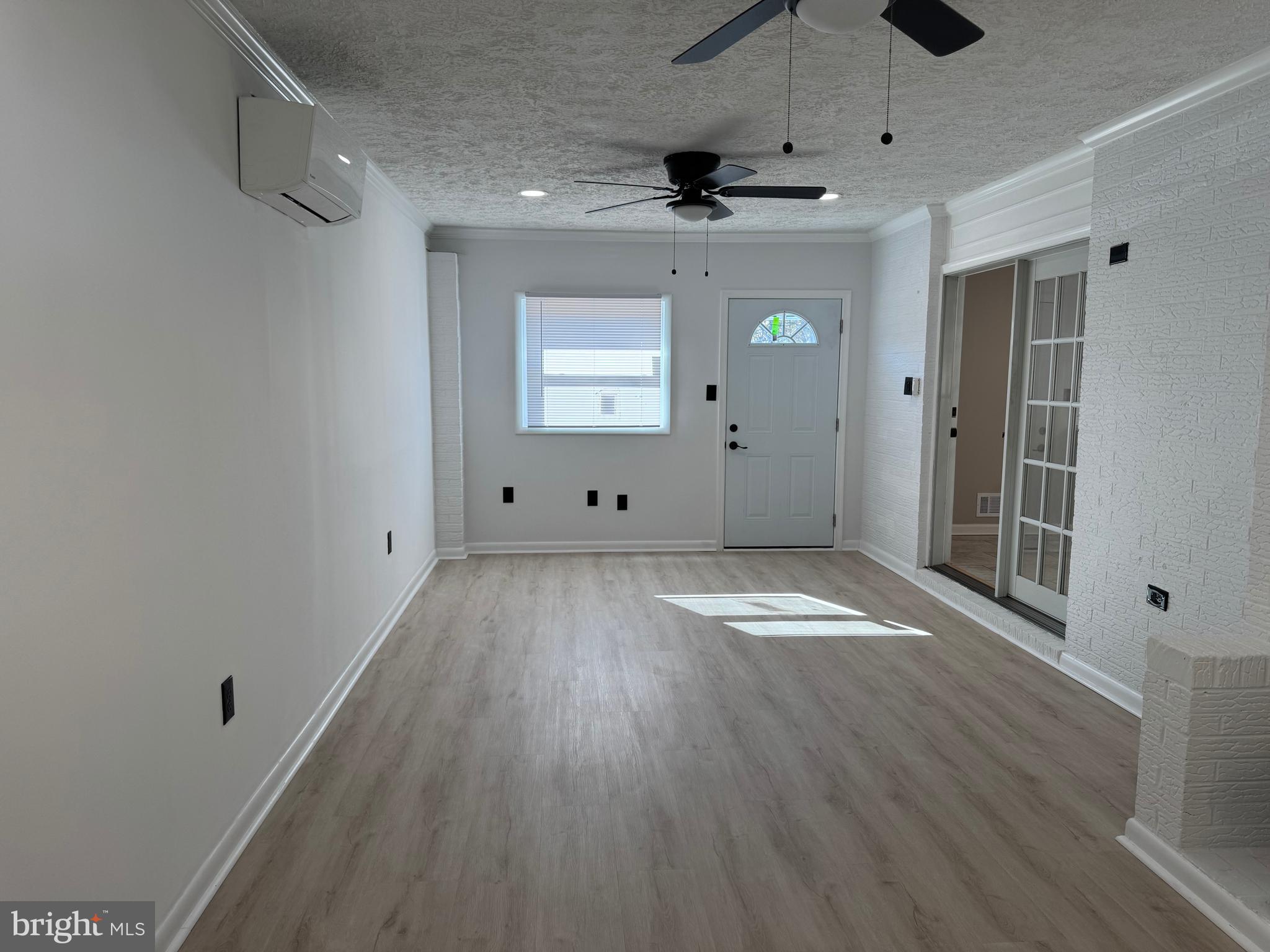 602 Eliot Road Pasadena, MD 21122 - Photo 14 of 30 a view of empty room with wooden floor and fan