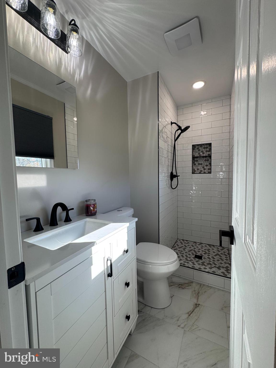 602 Eliot Road Pasadena, MD 21122 - Photo 25 of 30 a bathroom with a sink toilet and shower