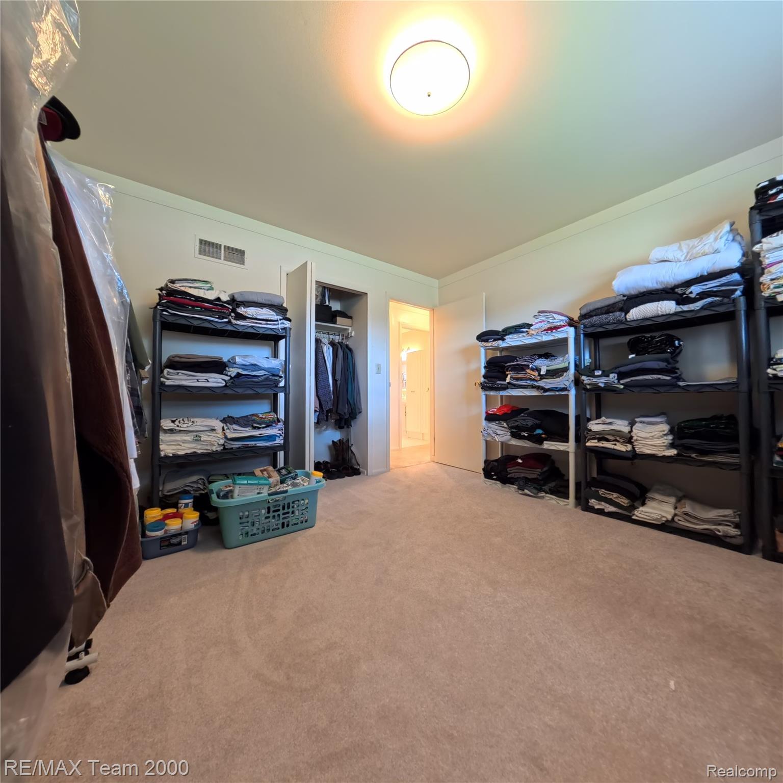 2104 Whittier Road Ypsilanti, MI 48197 - Photo 21 of 45 Walk in closet with light carpet