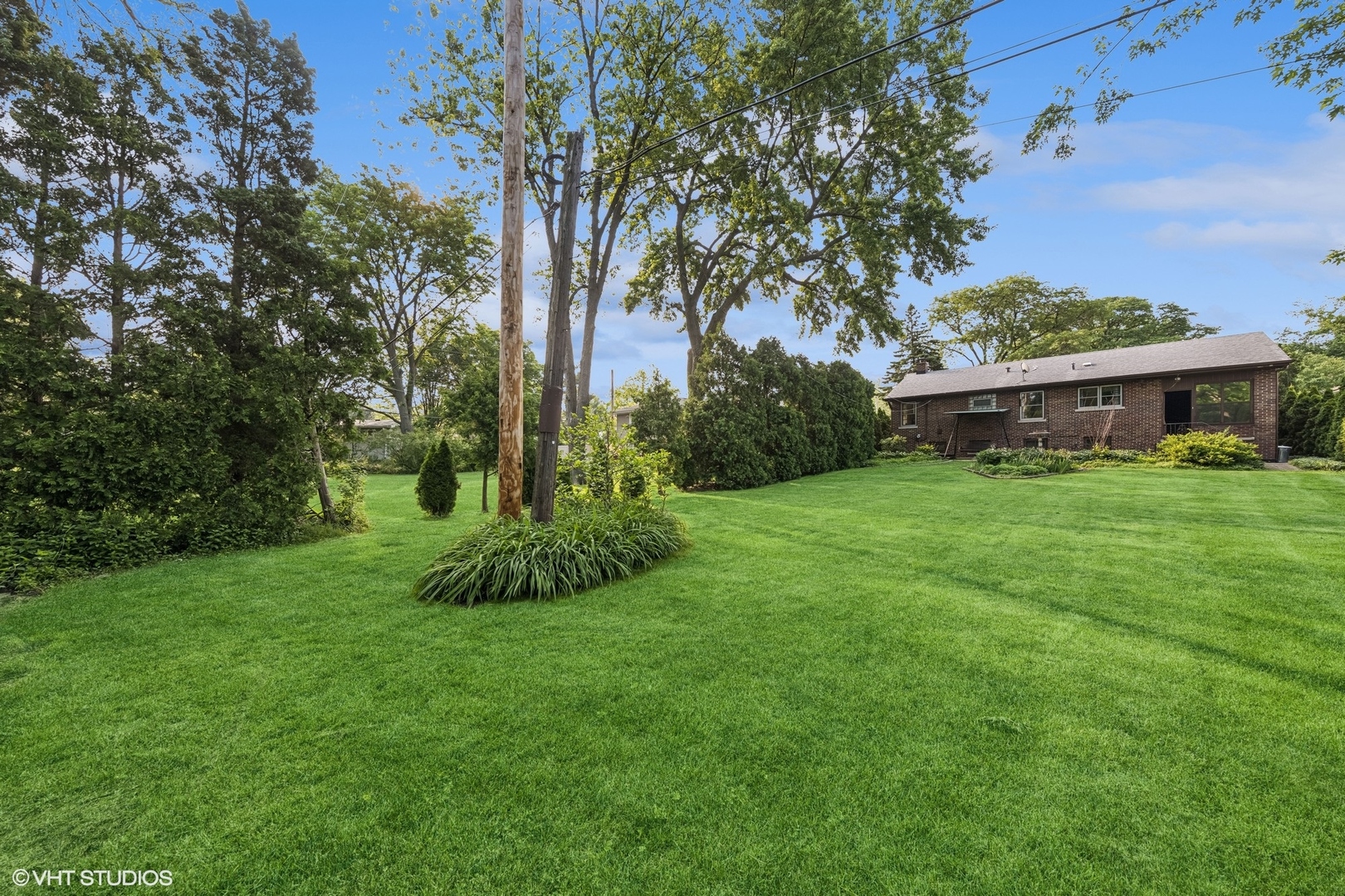 308 Sheldon Avenue Downers Grove, IL 60515 - Photo 24 of 36 a view of a garden with a house in the background
