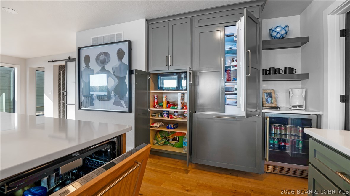 5590 Alona Point Osage Beach, MO 65065 - Photo 12 of 46 Custom cabinetry incorporated over Refrigerator, D