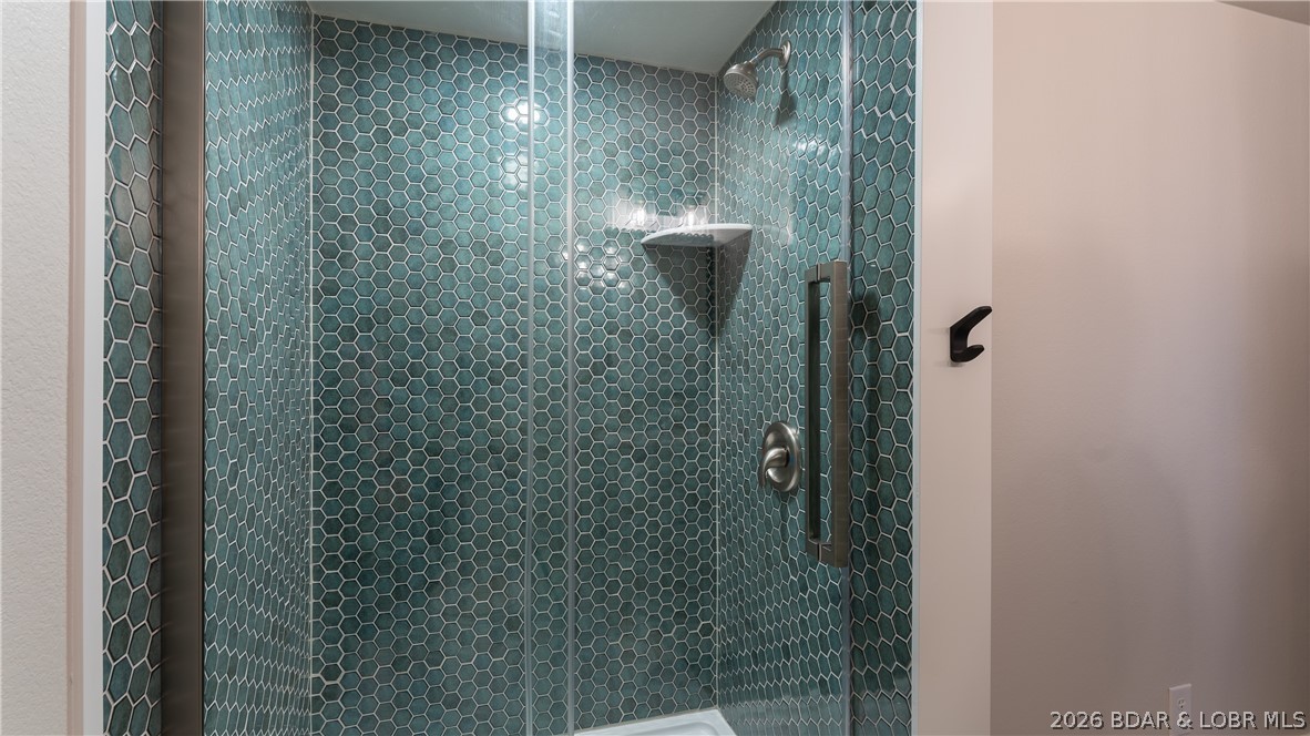 5590 Alona Point Osage Beach, MO 65065 - Photo 28 of 46 Gorgeous custom tiled walk-in shower