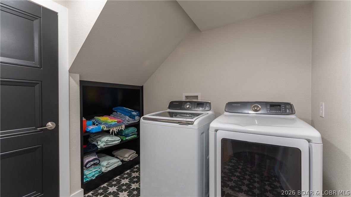 5590 Alona Point Osage Beach, MO 65065 - Photo 30 of 46 Utility Room with full washer/dryer and storage