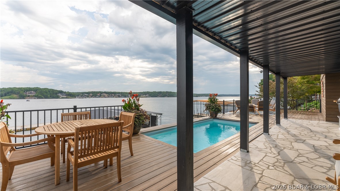 5590 Alona Point Osage Beach, MO 65065 - Photo 32 of 46 Expansive entertaining area with pool and multiple