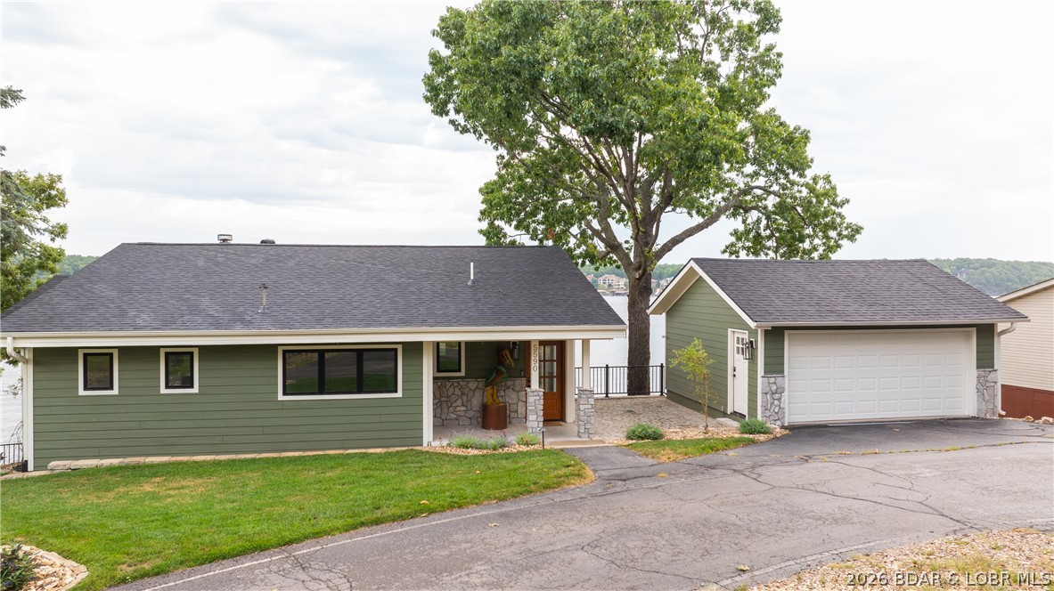 5590 Alona Point Osage Beach, MO 65065 - Photo 39 of 46 Flat yard and parking with additional parking acro