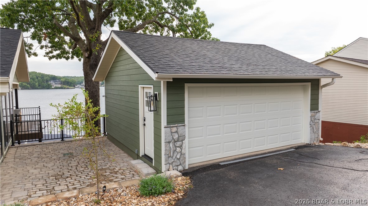 5590 Alona Point Osage Beach, MO 65065 - Photo 41 of 46 2 car garage with additional parking in front and